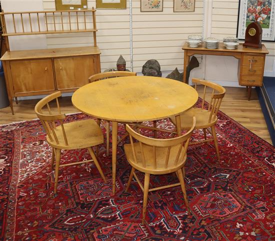 A 1950s satin sycamore or birch suite, purchased at Heals, table, four chairs, sideboard and an associated oak desk Sideboard W.126cm,